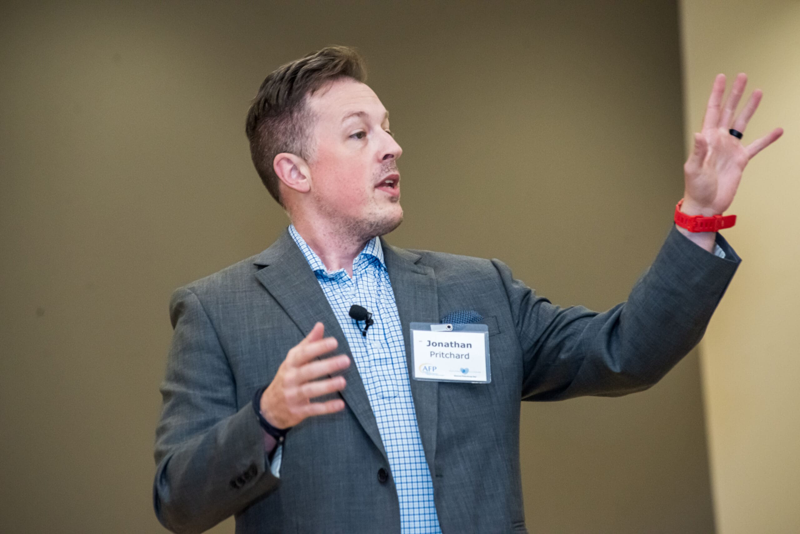 Jonathan W. Pritchard speaking at a recent philanthropy event on the topic of using experiential design to craft more effective storytelling for fund raising.